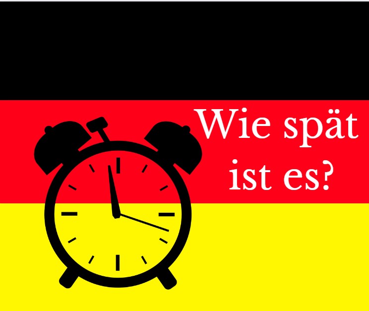 Grafika - tło flaga niemiecka, na niej kontur budzika i napis po niemiecku (Która godzina)